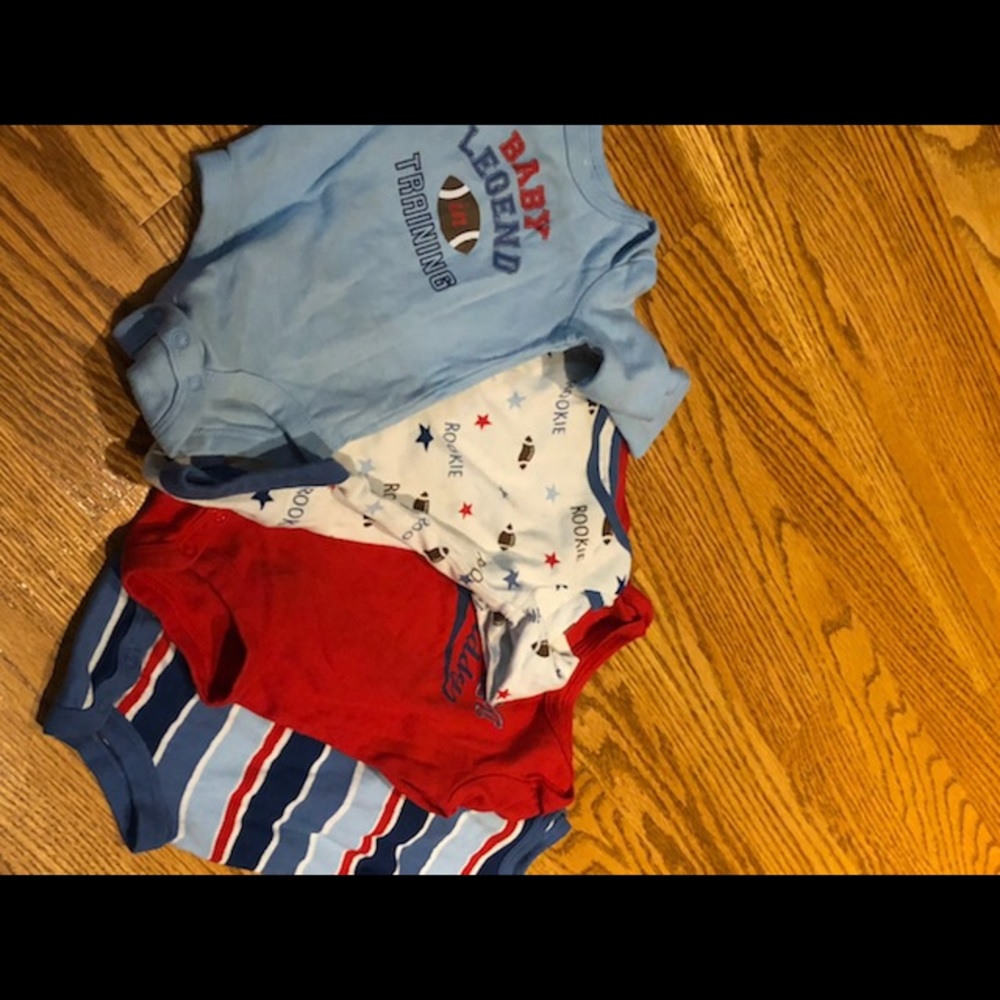 Four gently used Boy onsies